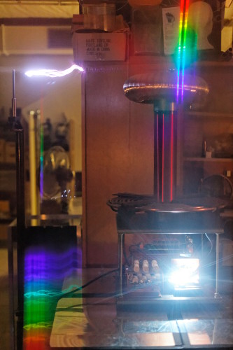 Click for a high-resolution version. Tesla coil lightnings trough diffraction grating